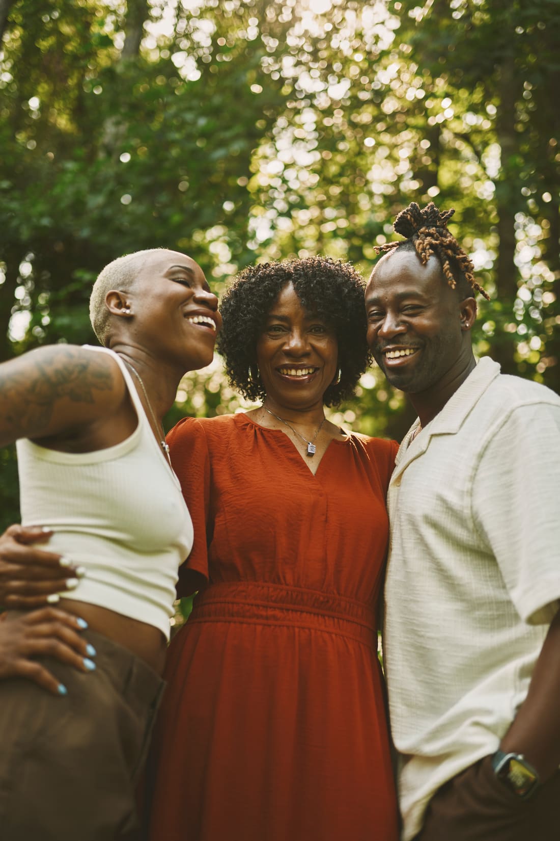Color family portrait of Nikki with family under summer trees
